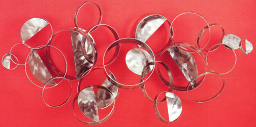 100679 circles in composition metal wall sculpture